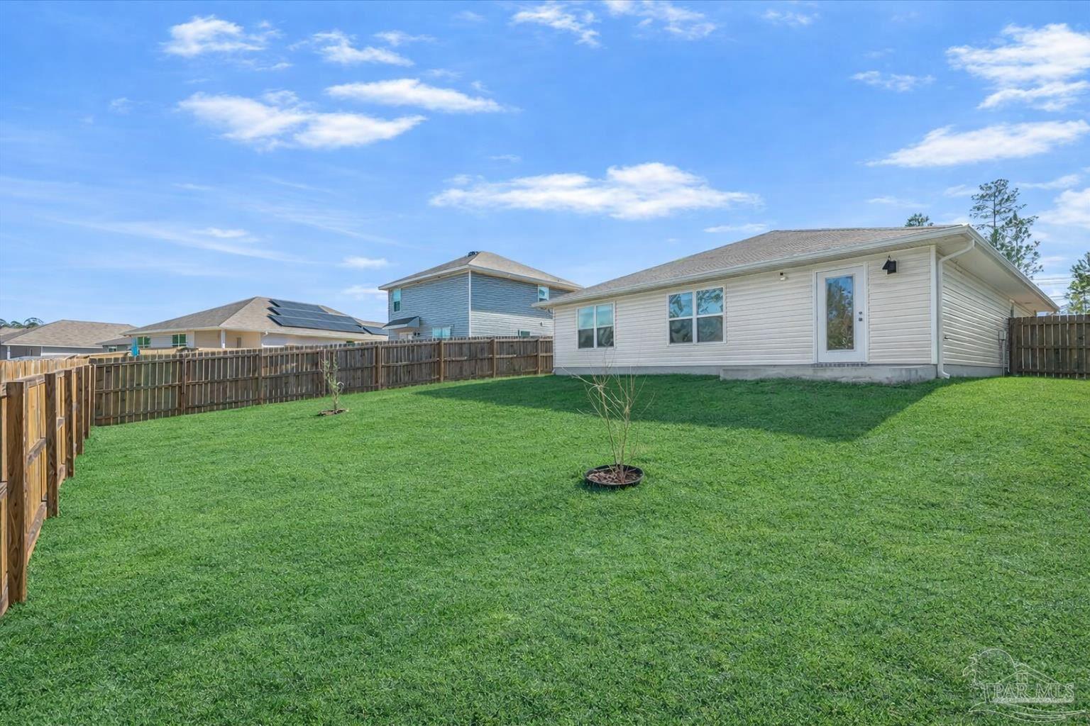 5872 Belmont Stakes Road Pensacola, FL 32526 - Photo 26 of 31 a view of a house with a backyard