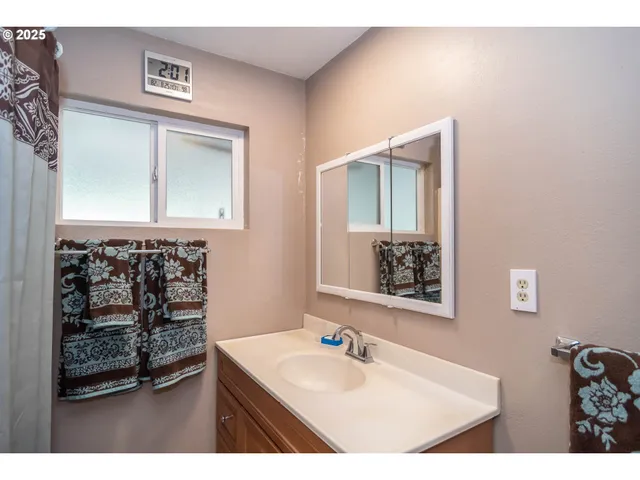 a view of room with window and hardwood floor