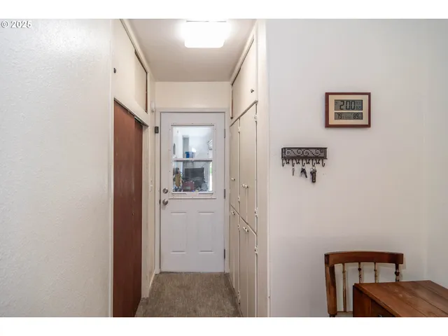 a living room with a couch and a stove