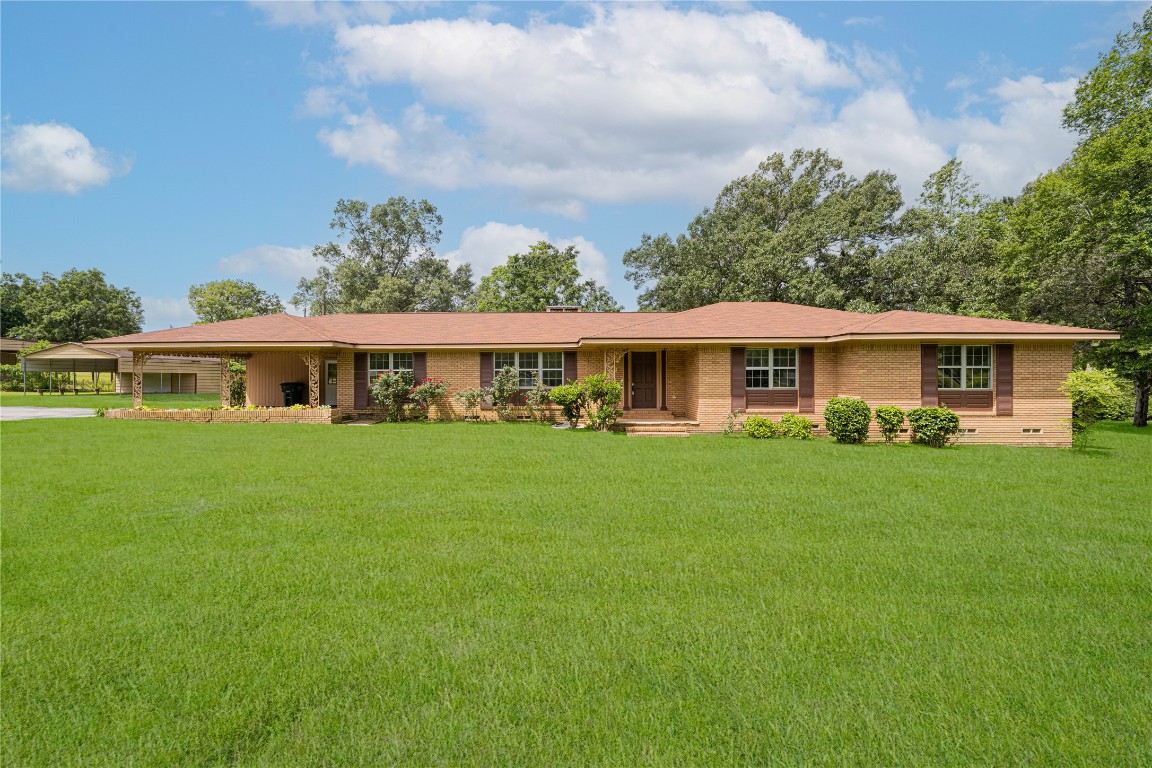 2208 Highway 96 Center, TX 75935 - Photo 1 of 1 a front view of house with yard and green space