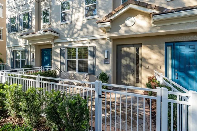 a view of a building with a small yard