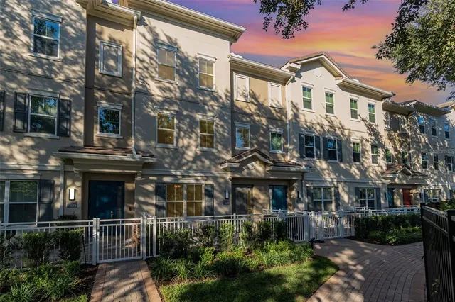 a view of a building with a yard