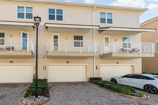 a front view of a house with garage