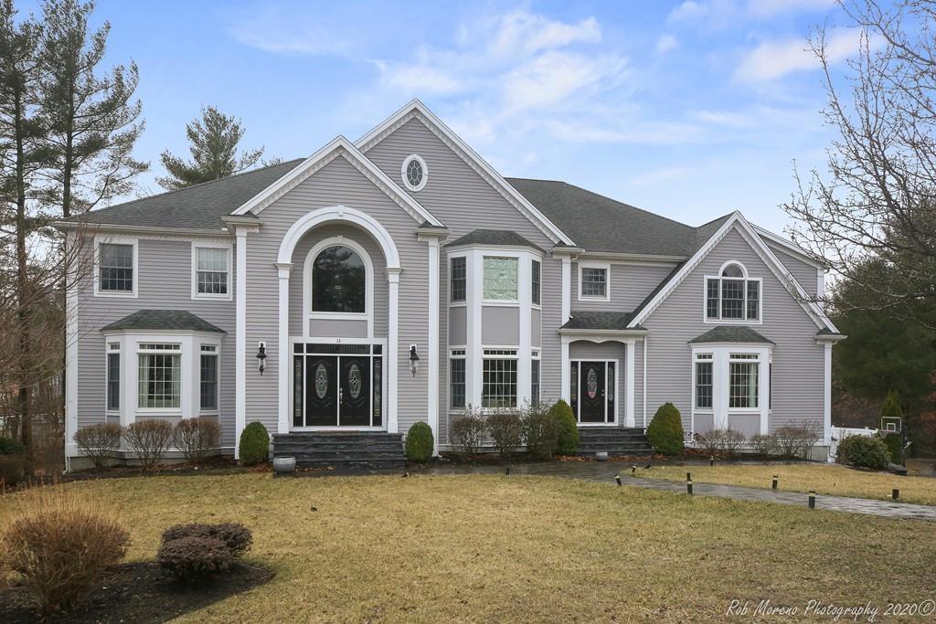 13 Pollock Drive Middleton, MA 01949 - Photo 1 of 42 a front view of a house with a garden