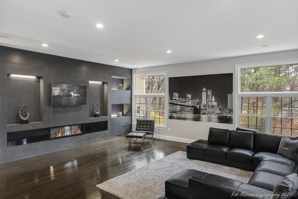 13 Pollock Drive Middleton, MA 01949 - Photo 11 of 42 a living room with furniture and a large window