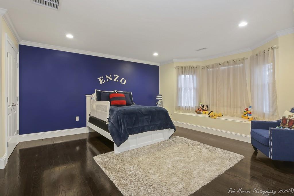 13 Pollock Drive Middleton, MA 01949 - Photo 16 of 42 a bedroom with a bed a couch and dresser