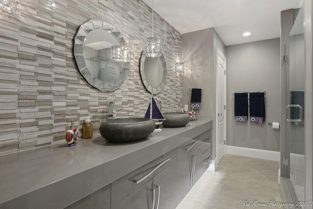 13 Pollock Drive Middleton, MA 01949 - Photo 17 of 42 a room with a wooden floor a mirror a glass door and a wooden floors