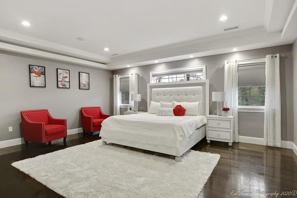 13 Pollock Drive Middleton, MA 01949 - Photo 18 of 42 a bedroom with a bed and wooden floor