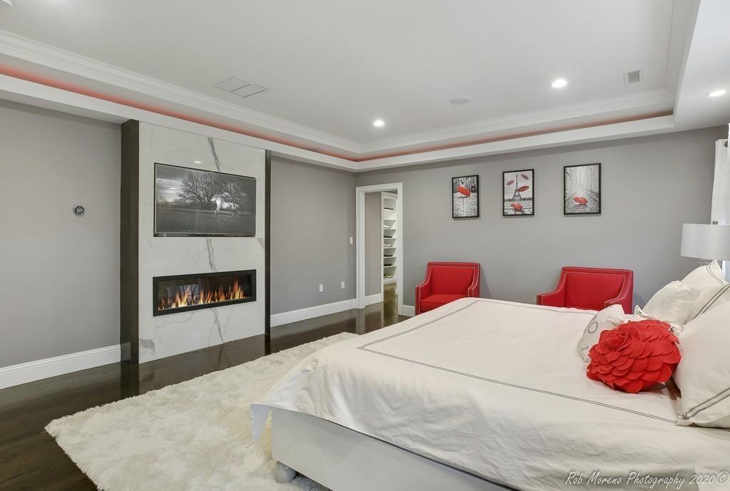 13 Pollock Drive Middleton, MA 01949 - Photo 19 of 42 a bedroom with a large bed and a large mirror