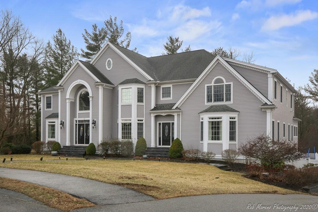 13 Pollock Drive Middleton, MA 01949 - Photo 2 of 42 a view of a brick house with a clock tower in front of it