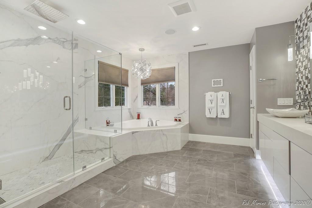 13 Pollock Drive Middleton, MA 01949 - Photo 23 of 42 a spacious bathroom with a tub sink shower and mirror