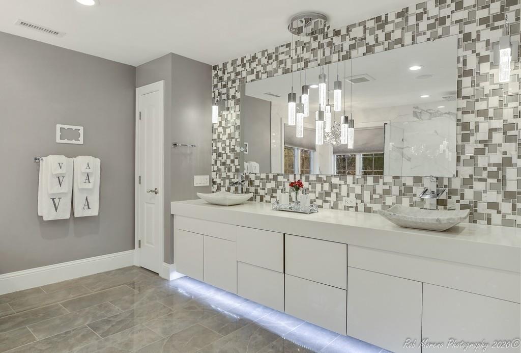 13 Pollock Drive Middleton, MA 01949 - Photo 24 of 42 a bathroom with a sink and a mirror