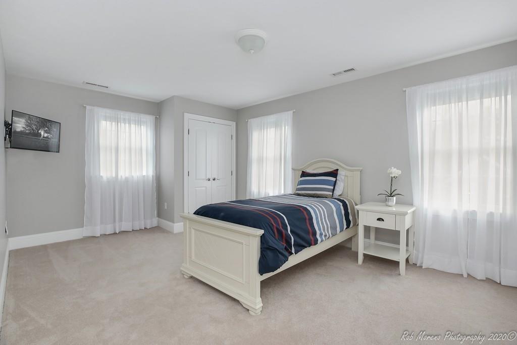 13 Pollock Drive Middleton, MA 01949 - Photo 27 of 42 a spacious bedroom with a bed and window