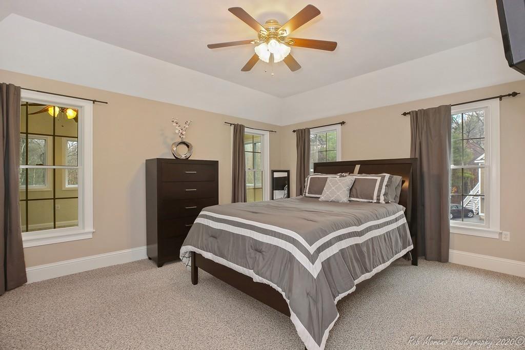 13 Pollock Drive Middleton, MA 01949 - Photo 33 of 42 a bedroom with a bed and window