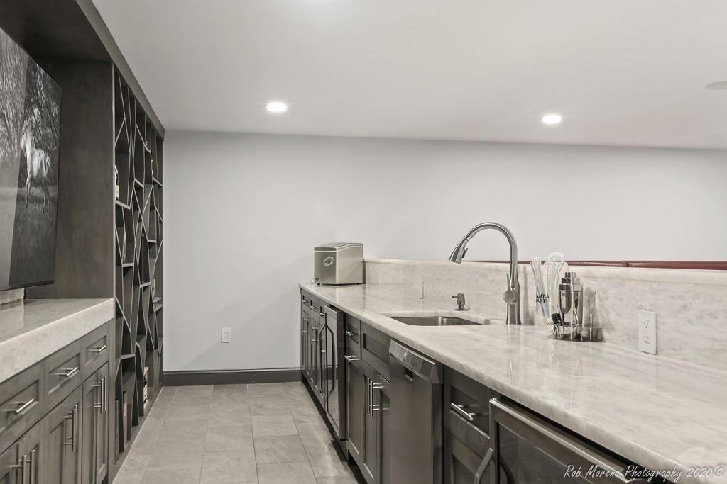 13 Pollock Drive Middleton, MA 01949 - Photo 39 of 42 a kitchen with a sink and a stove top oven