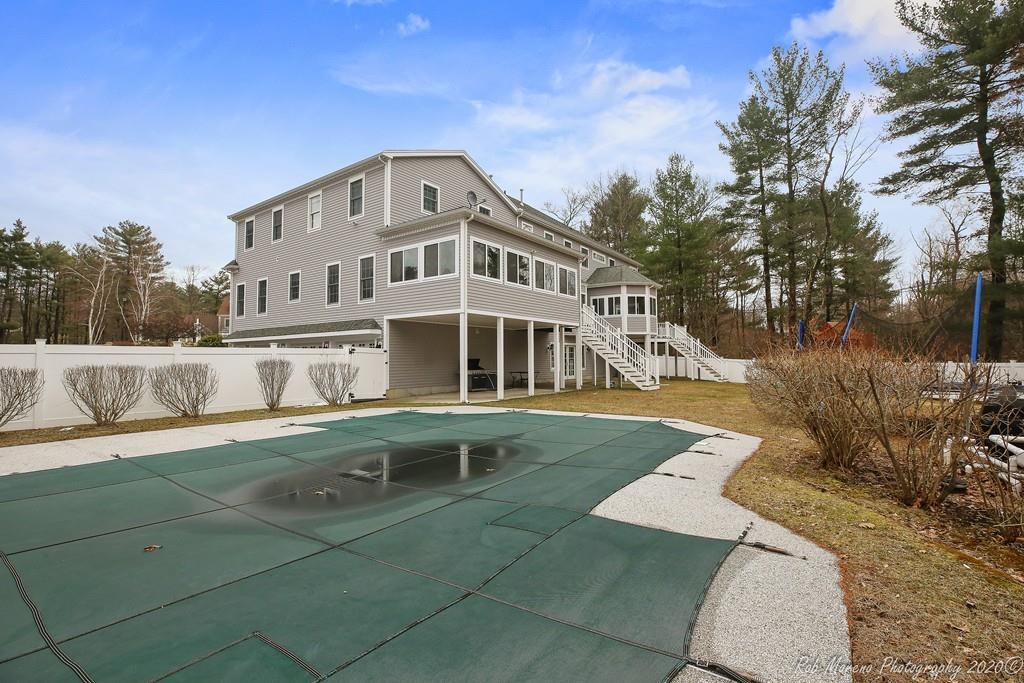 13 Pollock Drive Middleton, MA 01949 - Photo 41 of 42 a front view of a house with a garden