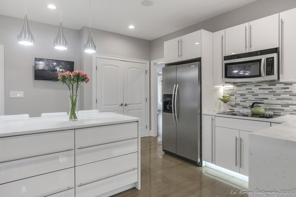 13 Pollock Drive Middleton, MA 01949 - Photo 6 of 42 a kitchen with kitchen island a sink stainless steel appliances and cabinets