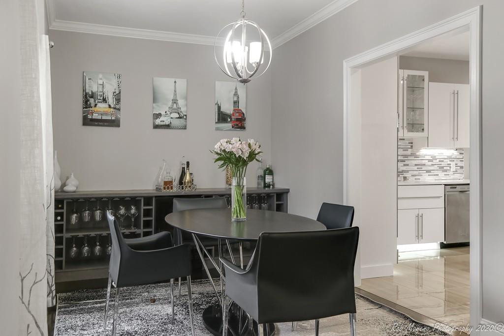 13 Pollock Drive Middleton, MA 01949 - Photo 10 of 42 a view of a dining room with furniture a chandelier and wooden floor