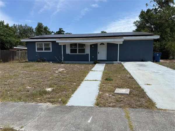 front view of a house with a yard