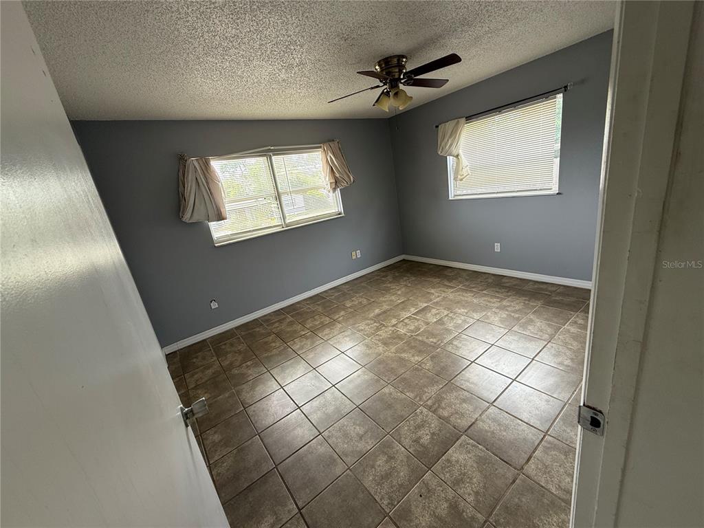 9275 Chase Street Spring Hill, FL 34606 - Photo 13 of 29 a view of an empty room with a window