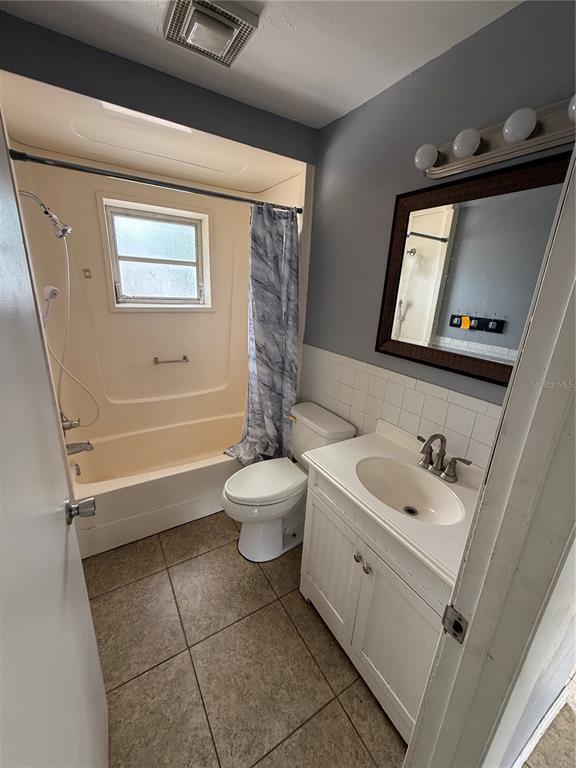 9275 Chase Street Spring Hill, FL 34606 - Photo 15 of 29 a bathroom with a sink a toilet and bathtub