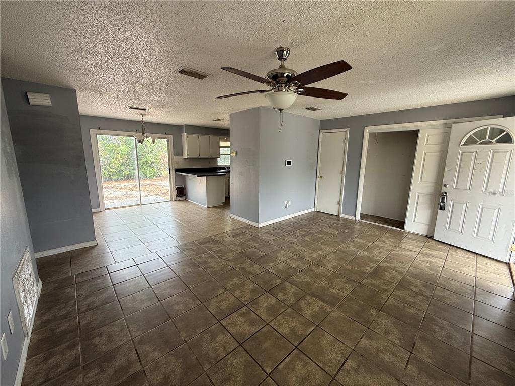 9275 Chase Street Spring Hill, FL 34606 - Photo 23 of 29 a view of empty room with wooden floor and fan