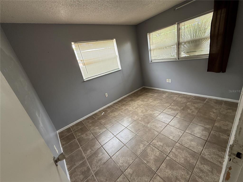 9275 Chase Street Spring Hill, FL 34606 - Photo 24 of 29 a view of an empty room and window