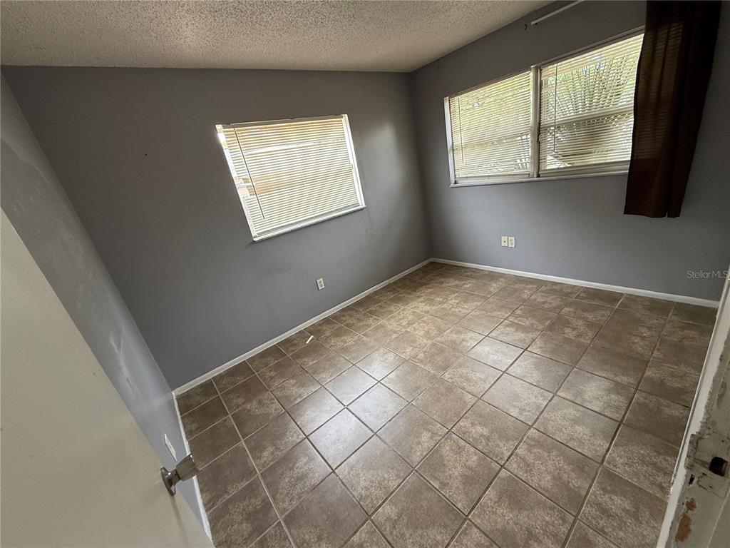 9275 Chase Street Spring Hill, FL 34606 - Photo 26 of 29 a view of an empty room with a window