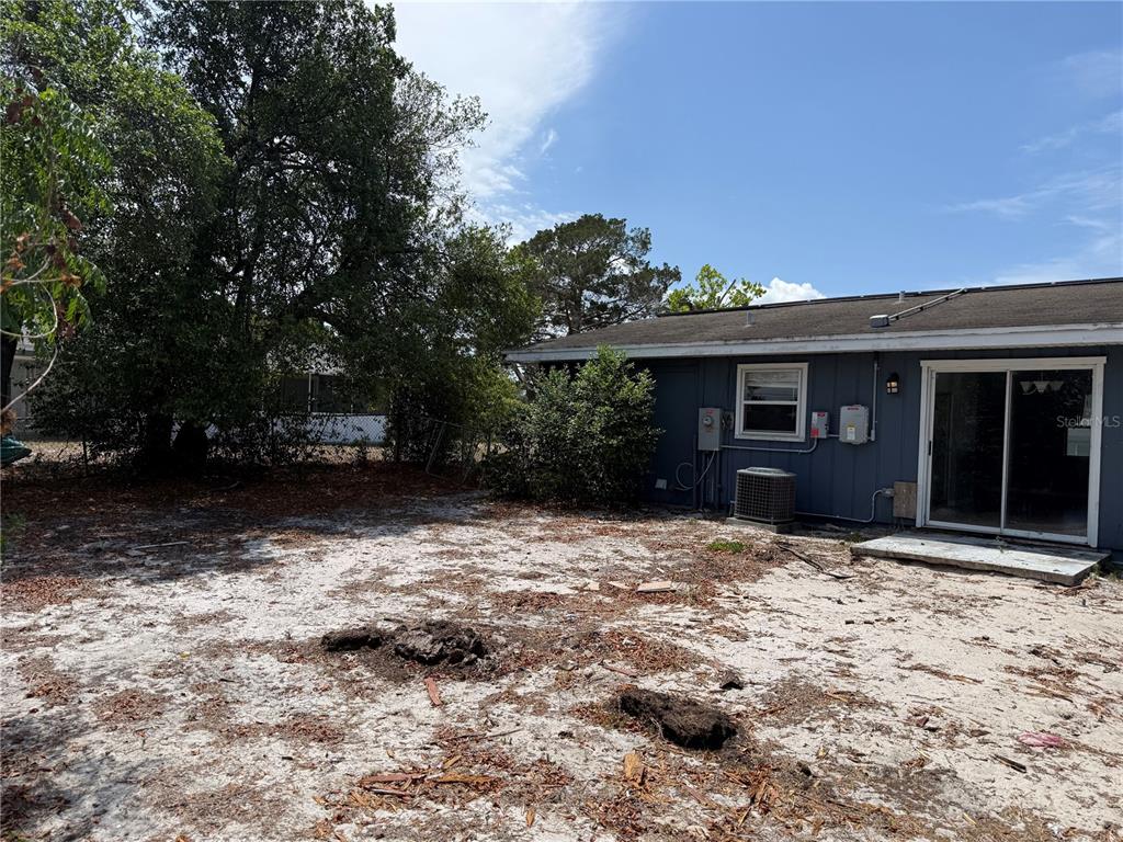 9275 Chase Street Spring Hill, FL 34606 - Photo 29 of 29 a backyard of a house with lots of green space