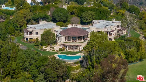an aerial view of a house with a garden