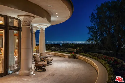 a view of swimming pool with outdoor seating and a projector