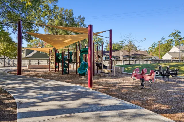 a view of a park with large trees
