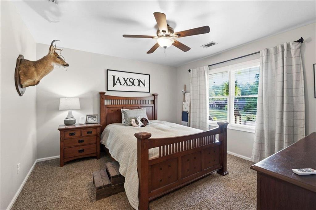 2777 Chickadee Drive Monroe, GA 30655 - Photo 24 of 36 a bedroom with a bed and a window
