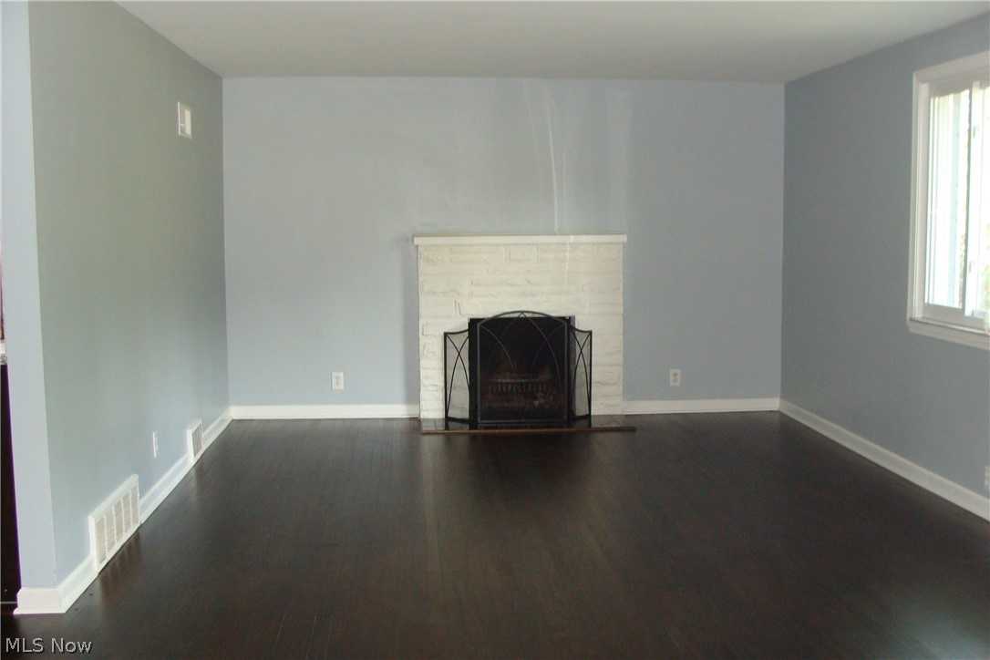 2230 Graham Road Stow, OH 44224 - Photo 10 of 34 Living room with wood burning fireplace and refinished hard wood floors