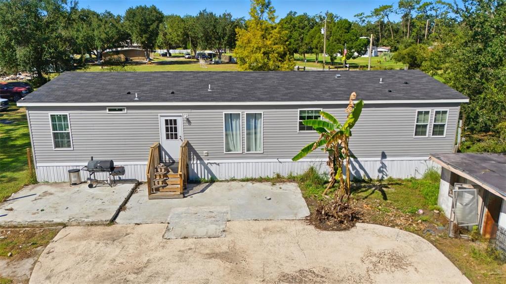 5022 Carol Drive Wesley Chapel, FL 33543 - Photo 18 of 25 a view of a house with patio