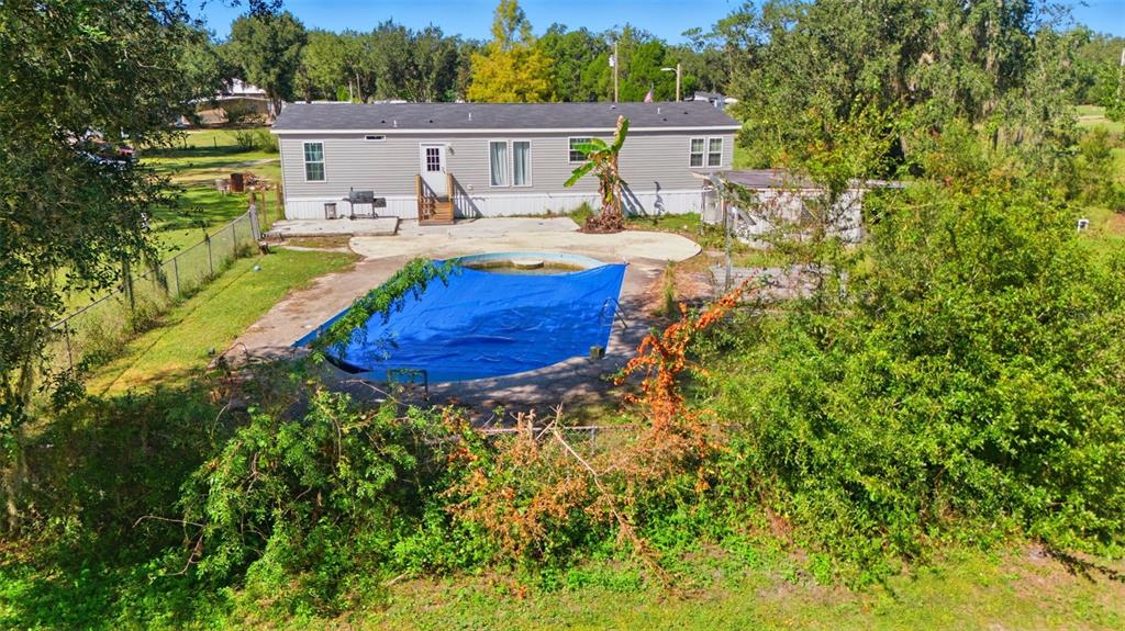 5022 Carol Drive Wesley Chapel, FL 33543 - Photo 19 of 25 a view of house with backyard space and seating
