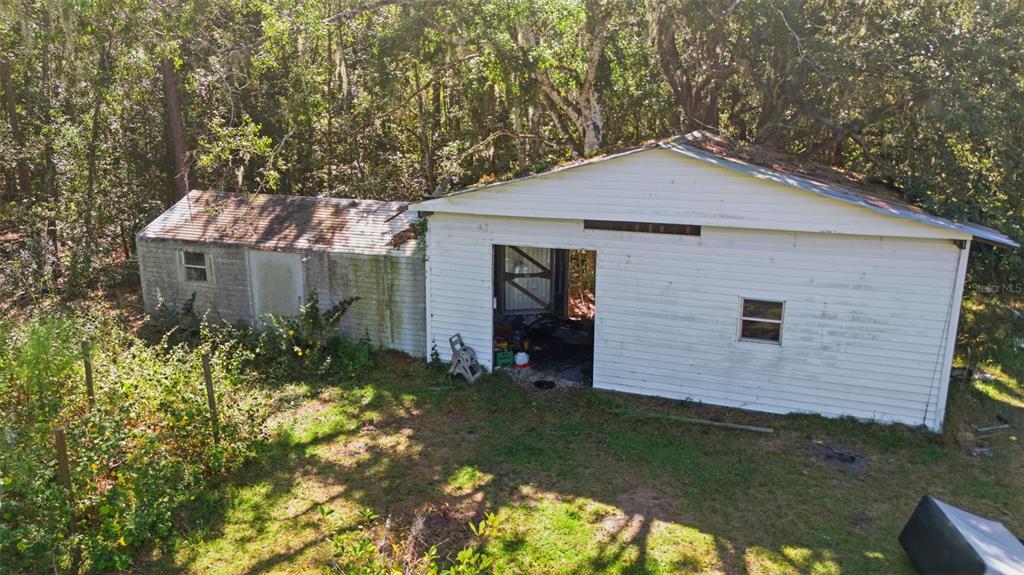 5022 Carol Drive Wesley Chapel, FL 33543 - Photo 20 of 25 a front view of a house with garden