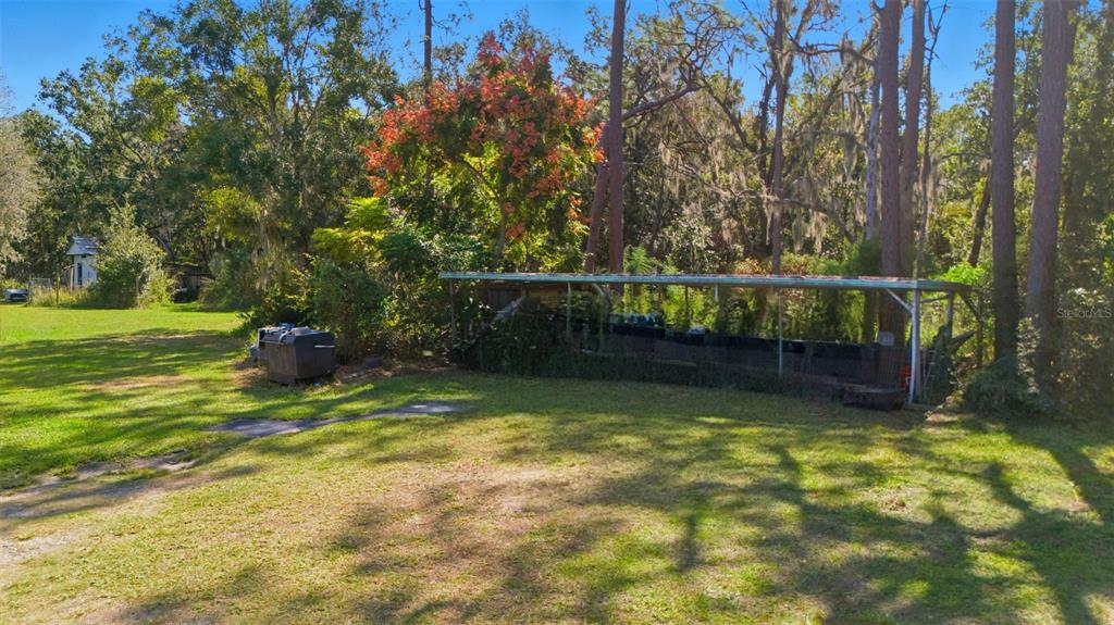 5022 Carol Drive Wesley Chapel, FL 33543 - Photo 21 of 25 a view of a swimming pool with a backyard