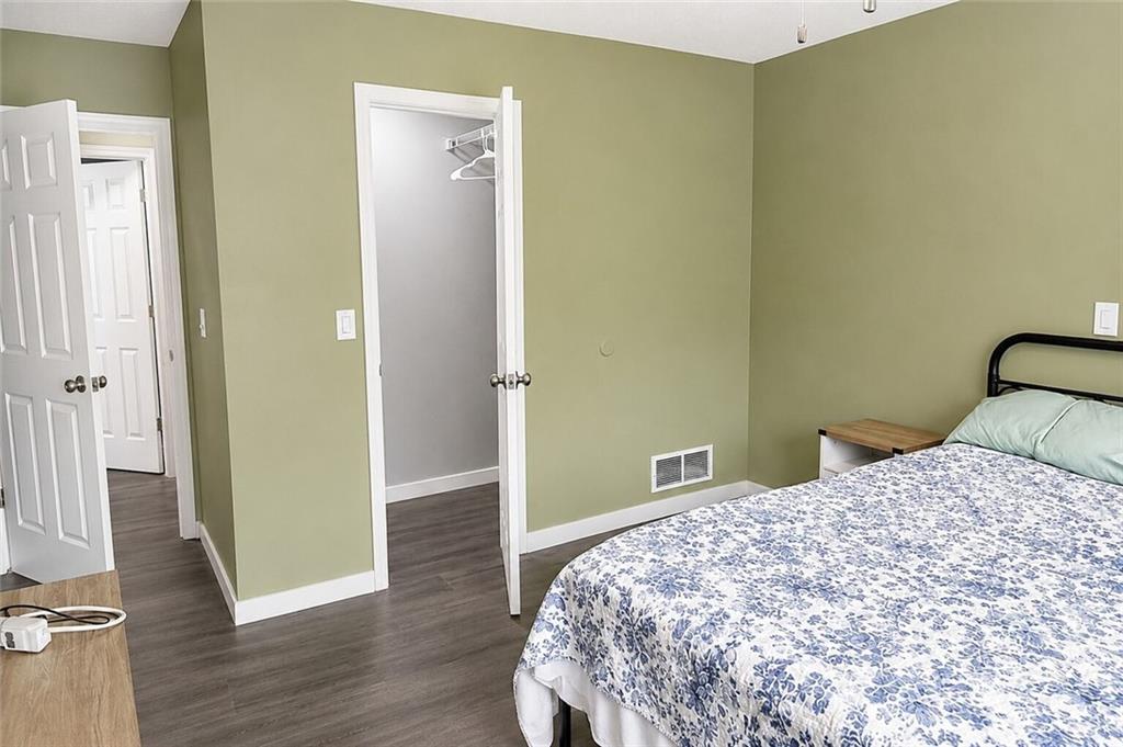 2033 Carson Segars Road Maysville, GA 30558 - Photo 22 of 41 a bedroom with a bed and wooden floor