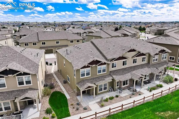 an aerial view of a house with a garden