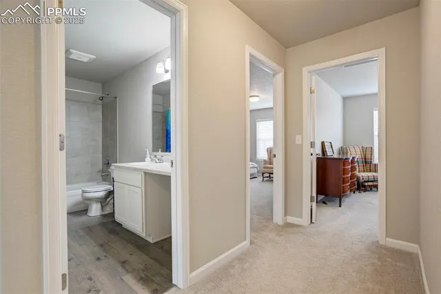 a bathroom with a toilet sink and shower