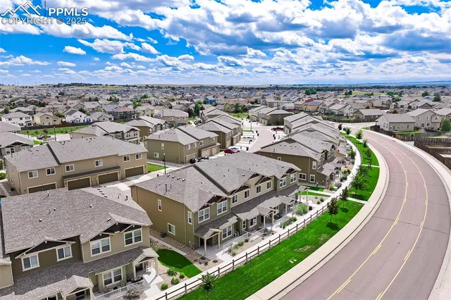 an aerial view of a house with a garden