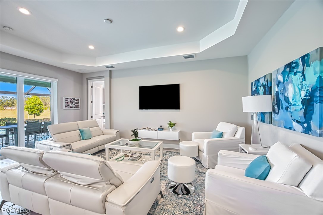 2925 Willow Ridge Court Fort Myers, FL 33905 - Photo 16 of 50 a living room with furniture and a flat screen tv