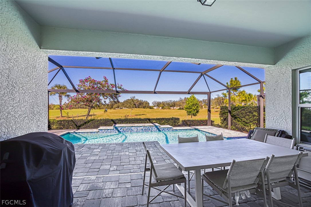 2925 Willow Ridge Court Fort Myers, FL 33905 - Photo 18 of 50 a view of a dining room with furniture and chandelier