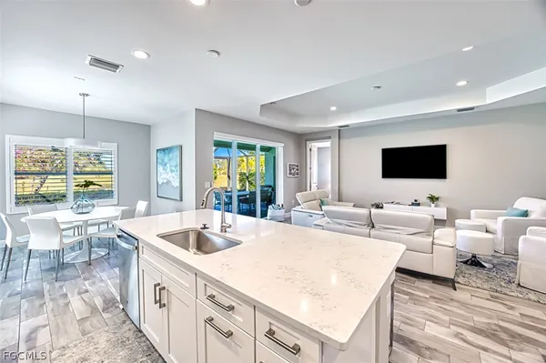 a living room with furniture and flat screen tv