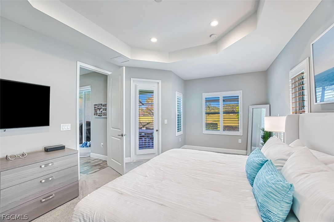2925 Willow Ridge Court Fort Myers, FL 33905 - Photo 40 of 50 a bedroom with a bed and a flat screen tv