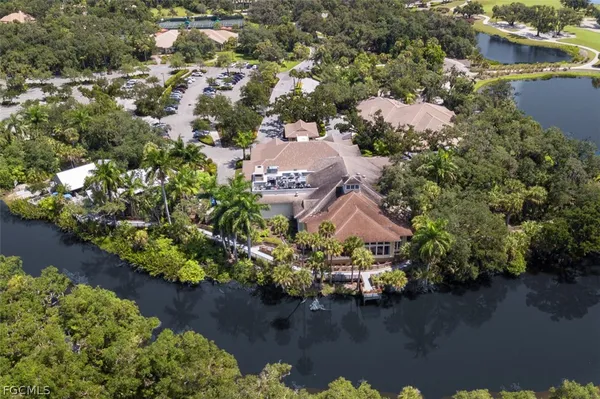 an aerial view of a houses with a lake view