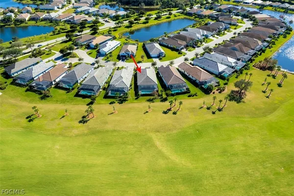 an aerial view of residential houses with swimming pool