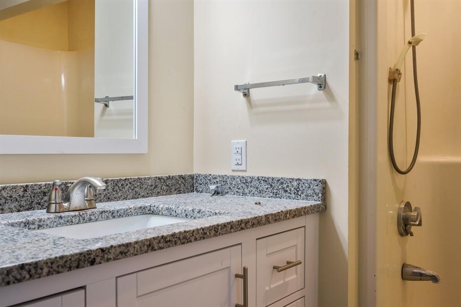 75 John Thomas Road Eastham, MA 02642 - Photo 23 of 23 a bathroom with a granite countertop sink and a mirror