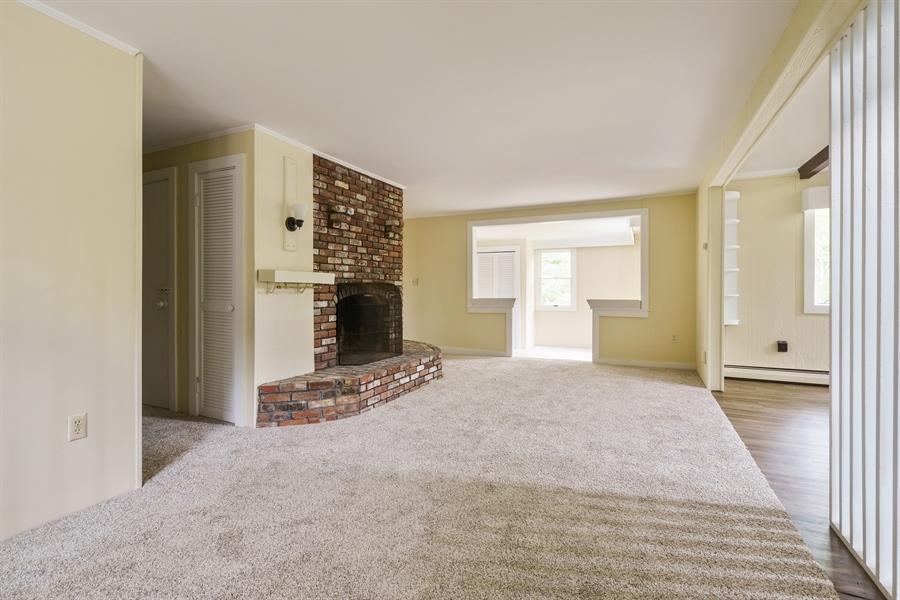 75 John Thomas Road Eastham, MA 02642 - Photo 4 of 23 a view of a livingroom with wooden floor and kitchen space